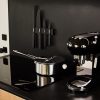Smeg cooktop, Smeg espresso machine, All-Clad cookware, Stelton knives & magnetic mount, countertop made of Richlite (paper product!). The Smeg cooktop is induction..it's energy efficient, cleans extremely easily and heats up in a flash. The Allclad pots and pans not only nest well together, they also feature 3 flat lids that store in no space at all and due to their flatness, can be used on more than one pot each.